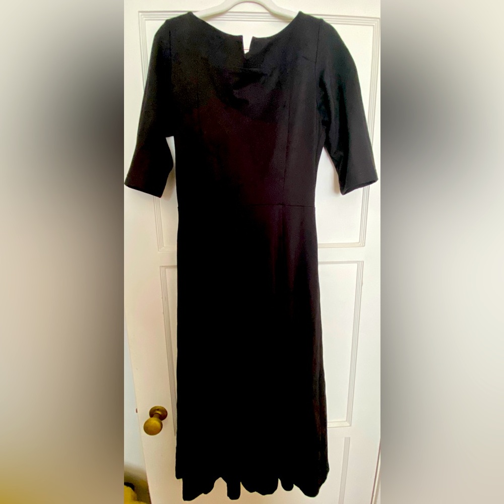 Simple classic black dress with zipper on back.  Sz8